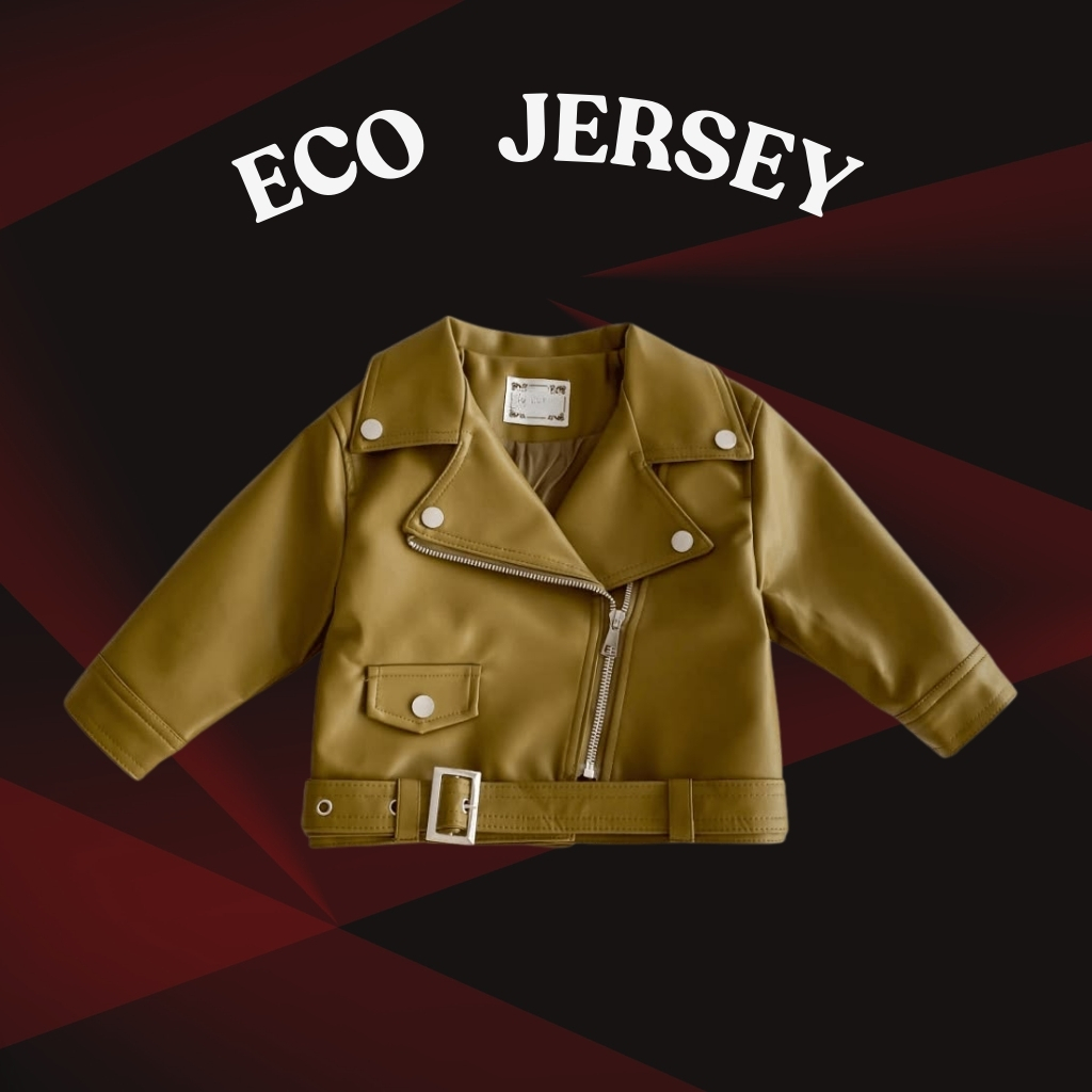 Soft Faux Leather Baby Jacket – Comfortable & Trendy Wear 5 A tan faux-leather baby motorcycle-style jacket is centered on a dark background with a red geometric pattern. It features a partially zipped silver zipper, a small pocket with a silver button, and a belt with a silver buckle. Silver collar buttons and the text “ECO JERSEY” appear above the jacket.