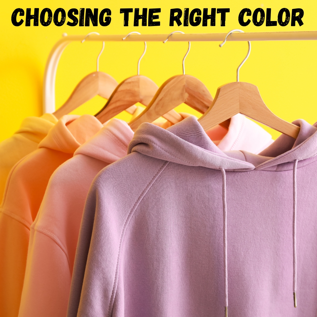Slim-Fit Zip Hoodie: A Must-Have Wardrobe Staple 6 Close-up of a row of hoodies hanging on wooden hangers against a bright yellow background, showing pastel colors such as yellow, orange, pink, and purple; the text 'CHOOSING THE RIGHT COLOR' appears at the top.