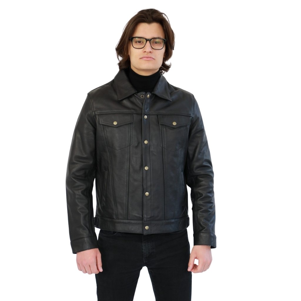 A man wearing a black leather jacket over a black turtleneck and black jeans, with glasses, standing against a white background.enim Style Leather Jacket