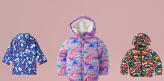 Dino Dash Jacket for Kids: Fun, Cozy, & Adventure-Ready Outerwear Three kids’ jackets displayed against a pink background: a blue jacket with white dinosaur bones and orange dinosaur silhouettes on the left, a lavender-purple puffer jacket with colorful dinosaurs and mint-green dinosaur spikes along the hood in the center, and a multicolored dinosaur camouflage puffer jacket on the right. Caption: