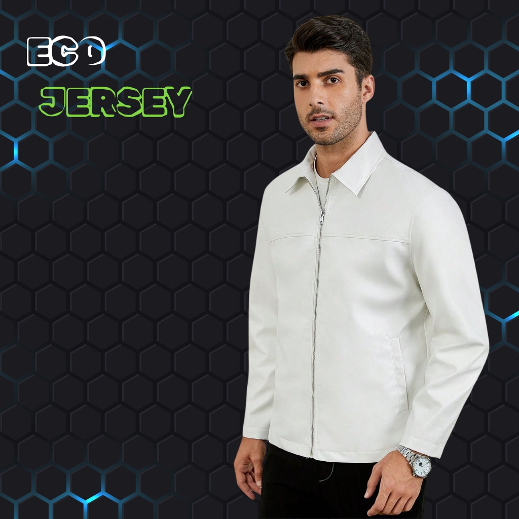 A man wearing a white jacket stands against a dark hexagonal-patterned background with blue neon accents, facing slightly to the left.