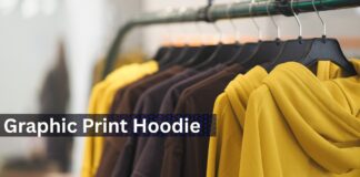 Graphic Print Hoodies: Ultimate Streetwear Guide A rack of hoodies on black hangers, with a bright yellow hoodie in the foreground and blurred yellow and brown hoodies in the background.