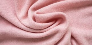 Lightweight Grade C Cashmere Fabric: Complete Guide Lightweight Grade C Cashmere Fabric Close-up of a soft pink knitted cashmere fabric arranged in a twisting spiral, showing the fine knit texture and gentle folds.