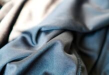 What Is Cryo Comfort Winter Fabric?A Complete Guide for 2026 Close-up of folded blue-grey fabric with soft texture and visible seam on the right; light-to-dark color gradient.What Is Cryo Comfort Winter Fabric?