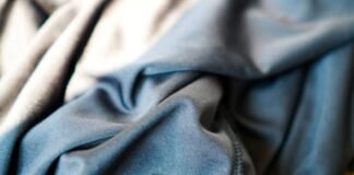 What Is Cryo Comfort Winter Fabric?A Complete Guide for 2026 Close-up of folded blue-grey fabric with soft texture and visible seam on the right; light-to-dark color gradient.What Is Cryo Comfort Winter Fabric?