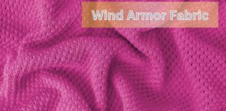 Wind Armor Fabric: Ultimate Windproof Protection Explained Alt text: Close-up of bright pink wind armor fabric with small evenly spaced holes and textured folds; text "Wind Armor Fabric" overlaid at top. Wind Armor Fabric:
