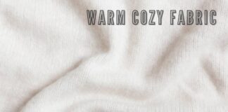 Ever Warm Cozy Fabric Guide: Stay,Warm Stylish & Comfortable Alt text: A close-up view of cream-colored fabric with soft folds and shadows, conveying a warm, cozy texture. The text "WARM COZY FABRIC" appears across the top in bold, shadowed lettering. Ever Warm Cozy Fabric Guide: