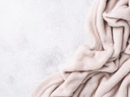 Cloud Fleece Winter Fabric: The Ultimate Soft & Warm Choice Alt text (short, descriptive): A pale pink plush blanket draped in soft folds against a light gray speckled background. Cloud Fleece Winter Fabric:Cloud Fleece Winter Fabric: