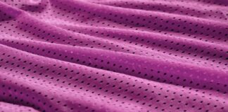 Fresh Vent Breathable Sports Cloth: Stay Cool While Active "Close-up of wrinkled purple fabric with small, evenly spaced perforations." Fresh Vent Breathable Sports Cloth: