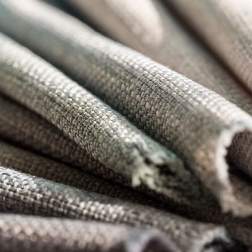 Cold-Blocking Fabric: The Key to Ultimate Winter Protection 9 Alt text: Close-up of folded, textured gray fabric with a woven pattern, showcasing soft, tactile folds.
Cold-Blocking Fabric: