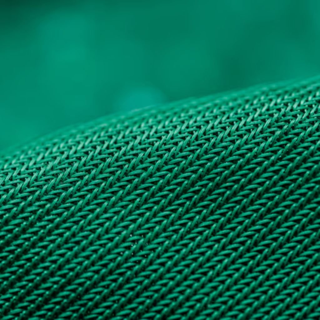 Alt text: Close-up of textured green woven fabric with diagonal ribbed pattern.
Wind Armor Fabric: