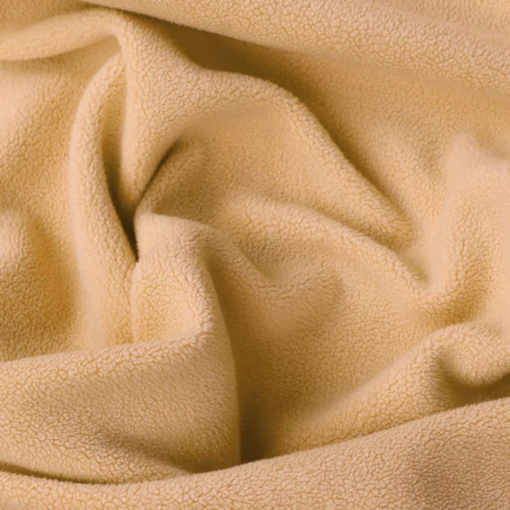 Alt text: Close-up of soft beige fabric with a plush, textured surface and gentle folds.

Polar Warm Weave Fabric Explained:
