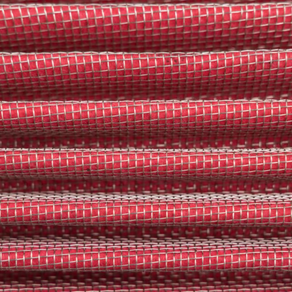 Alt text: "Close-up of stacked red fabric with a white grid weave pattern, showing a textured, shiny surface."
Heat Trap Insulation Fabric: