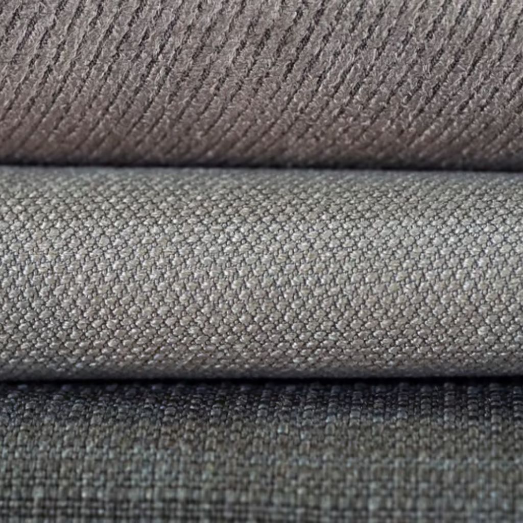 ThermoCore HeatLock Fabric: Advanced Winter Heat Protection 8 Alt text: Close-up of three stacked grey fabric samples. Top sample shows a diagonal texture, middle sample has a small square pattern, and bottom sample is a darker plain-textured grey.
ThermoCore HeatLock Fabric: