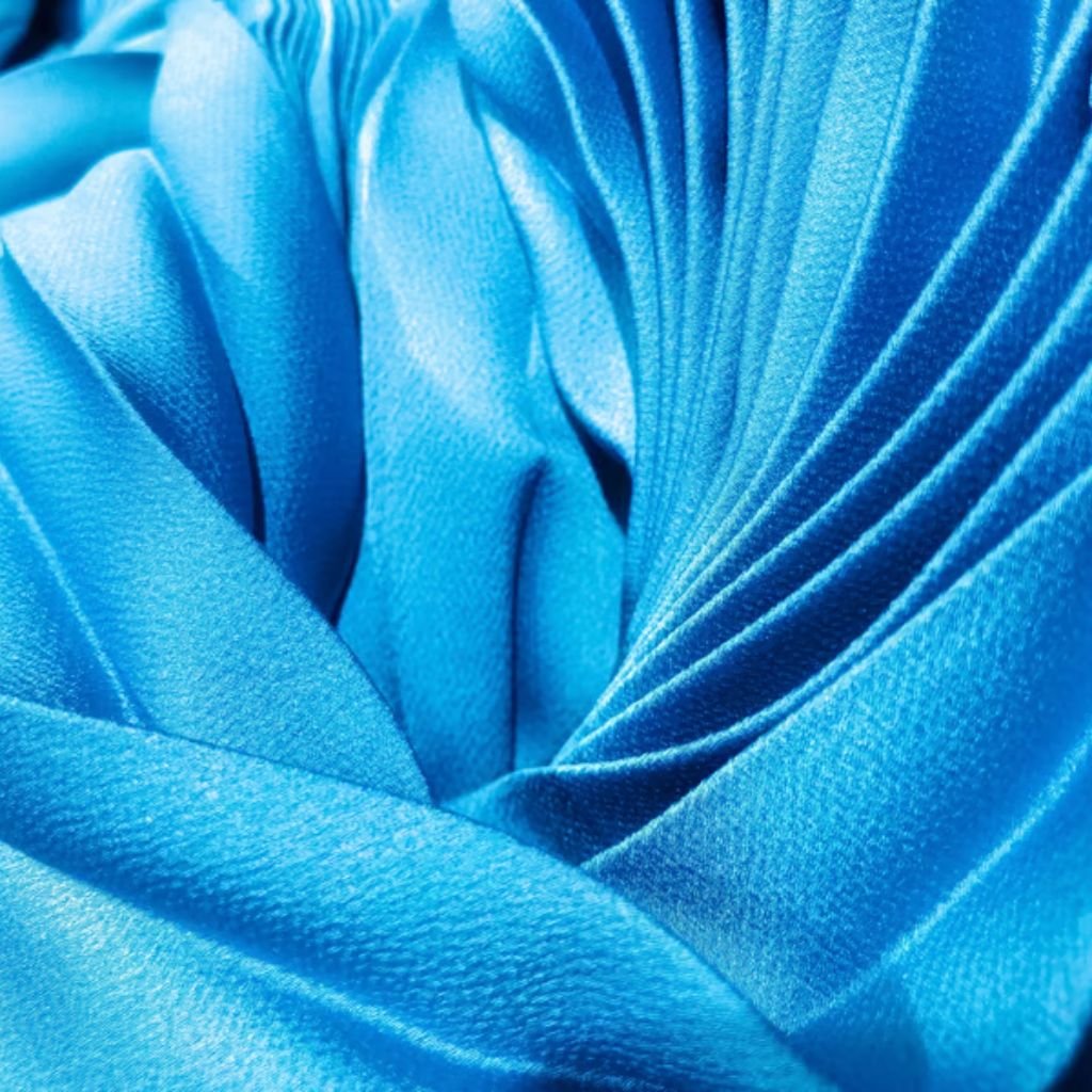Cold-Blocking Fabric: The Key to Ultimate Winter Protection 10 Alt text: Close-up view of bright blue fabric with soft, flowing folds and a plush texture.
Cold-Blocking Fabric: