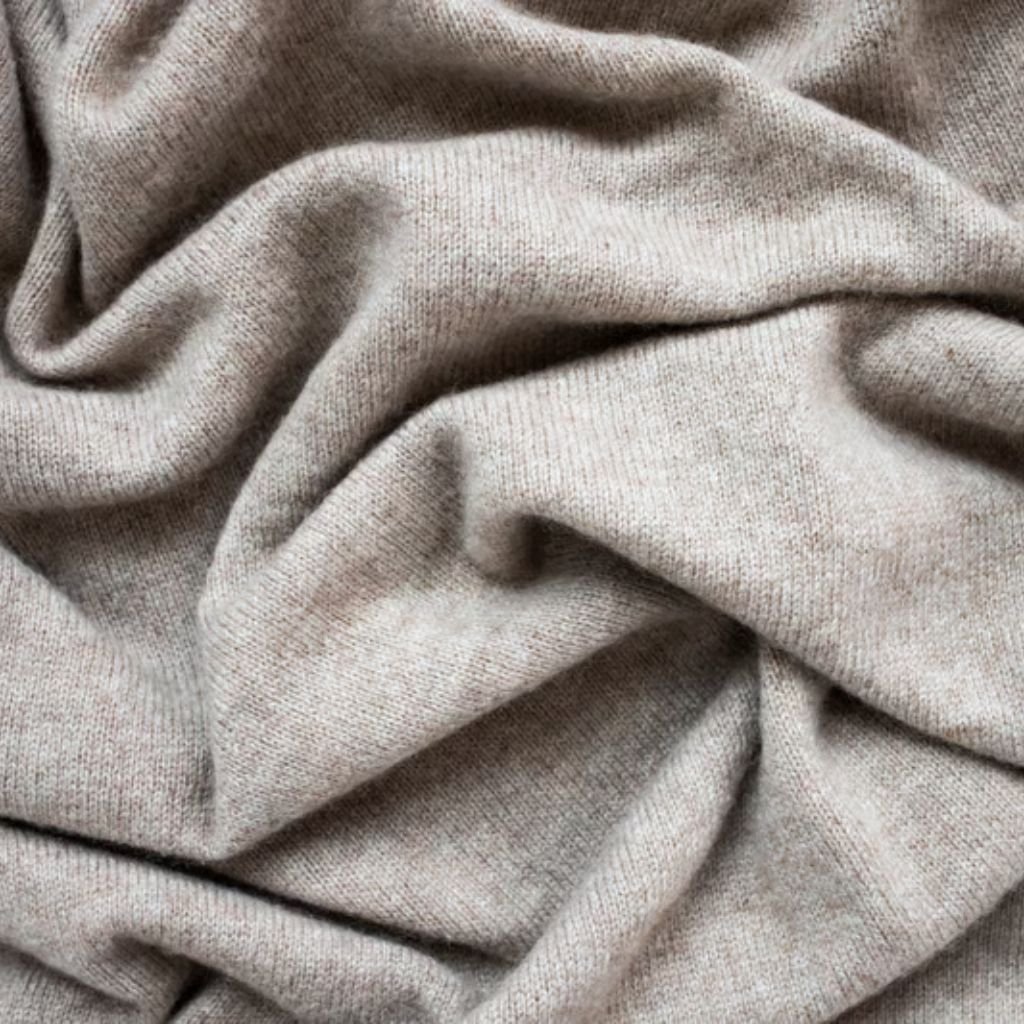 Alt text (short, screen-reader friendly): Close-up of soft, light gray fabric with gentle folds and a smooth, cozy texture.

What Is Heat Wave Wool Blend?