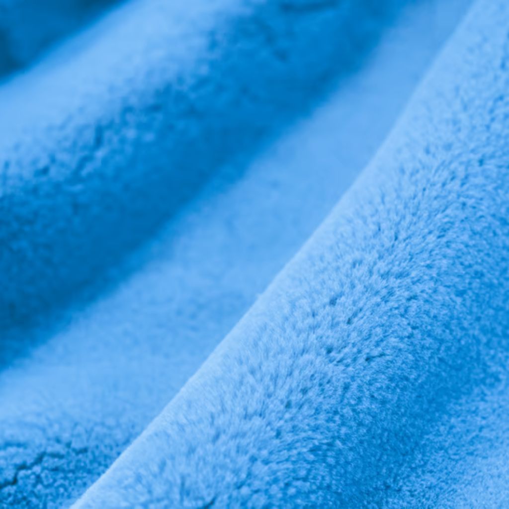 Cloud Fleece Winter Fabric: The Ultimate Soft & Warm Choice 4 Alt text (short, descriptive): A close-up of light blue, soft, furry fabric with gentle folds and subtle shadows.
Cloud Fleece Winter Fabric: