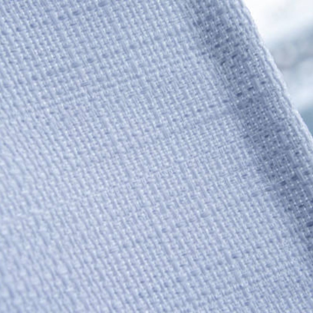Ice Glow Comfort Weave Fabric: Softness, Warmth & Durability 9 Alt text: A close-up view of light blue woven fabric, showing the detailed texture with visible interwoven threads.
Ice Glow Comfort Weave Fabric: