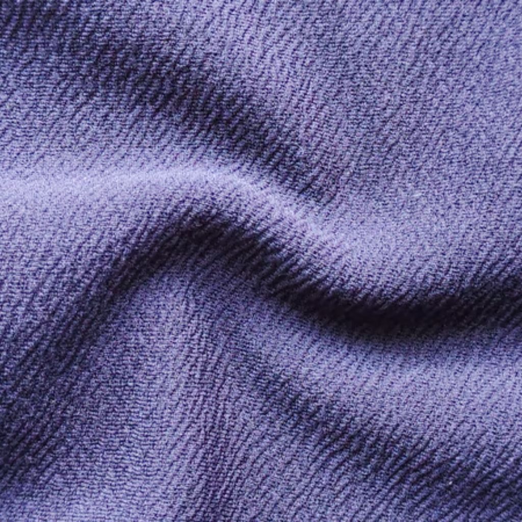 Ultra Motion Stretch Fabric: Performance, Durability & Style 9 A close-up of blue textured fabric showing ridge and valley patterns with shadows and highlights.
Ultra Motion Stretch Fabric: