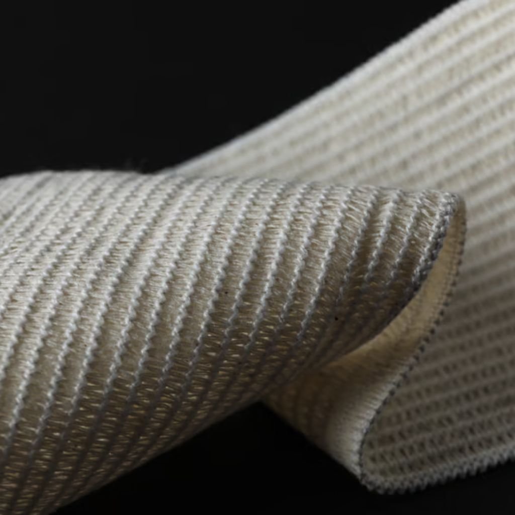 Caption: "A tactile close-up of ribbed, military-inspired fabric showcasing its sturdy weave and subtle color variation."
Heat Trap Insulation Fabric: