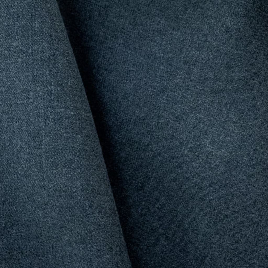 What Is Winter Lock Performance Fabric? Features & Benefits 7 Alt text: Close-up of dark blue textured fabric with a prominent fold, suggesting woolen material.
What Is Winter Lock Performance Fabric?
