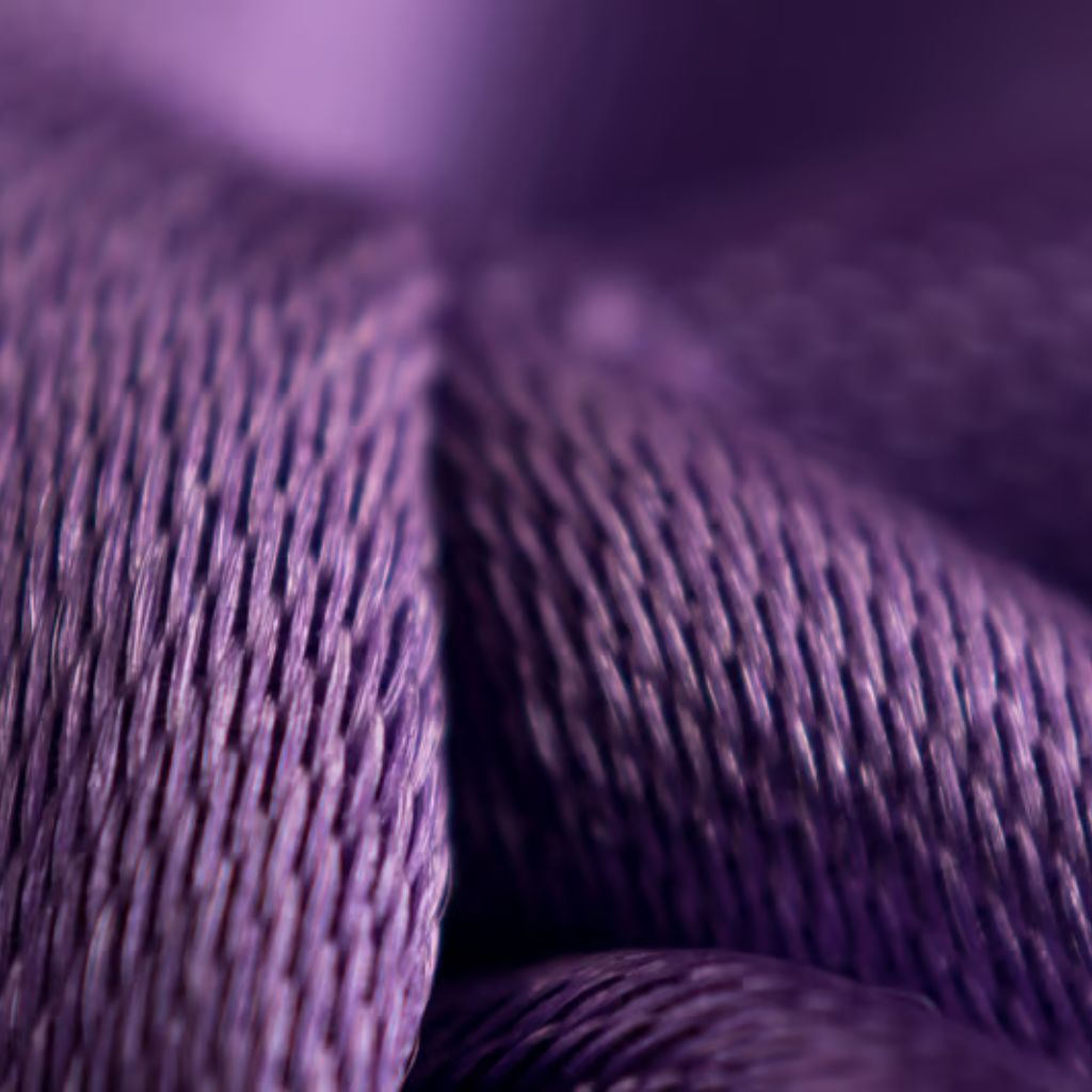 ThermoCore HeatLock Fabric: Advanced Winter Heat Protection 6 Alt text: Close-up of purple woven fabric with intricate texture, folds, and shallow depth of field.
ThermoCore HeatLock Fabric: