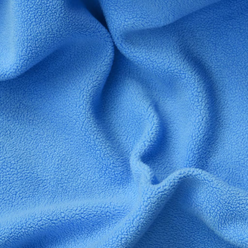Crystal Fleece Pro Fabric: Premium Warmth and Comfort Guide 6 "Close-up of wrinkled light blue microfleece fabric with a soft, plush texture. Lighting highlights depth and folds, creating curves and shadows."
Crystal Fleece Pro Fabric: