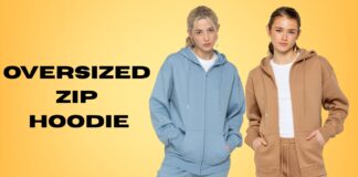 Oversized Zip Hoodie for Trendy Streetwear Comfort Two models wearing oversized zip hoodies and matching sweatpants stand against a yellow gradient background. The model on the left wears a light blue set with hands in pockets; the model on the right wears a tan/brown set with hands in pockets.