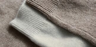 Benefits of Recycled Grade C Cashmere Fabric Recycled Grade C Cashmere Fabric A close-up view of a knitted garment showing two yarn colors: a light brown section with ribbed texture and an adjacent off-white section with smoother, more uniform knitting.
