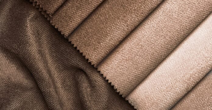 Types of Grade C Cashmere Wool Fabric Guide Close-up of diagonal swatches in brown tones with soft, textured fabric surfaces (likely velvet or corduroy), showcasing color variation.