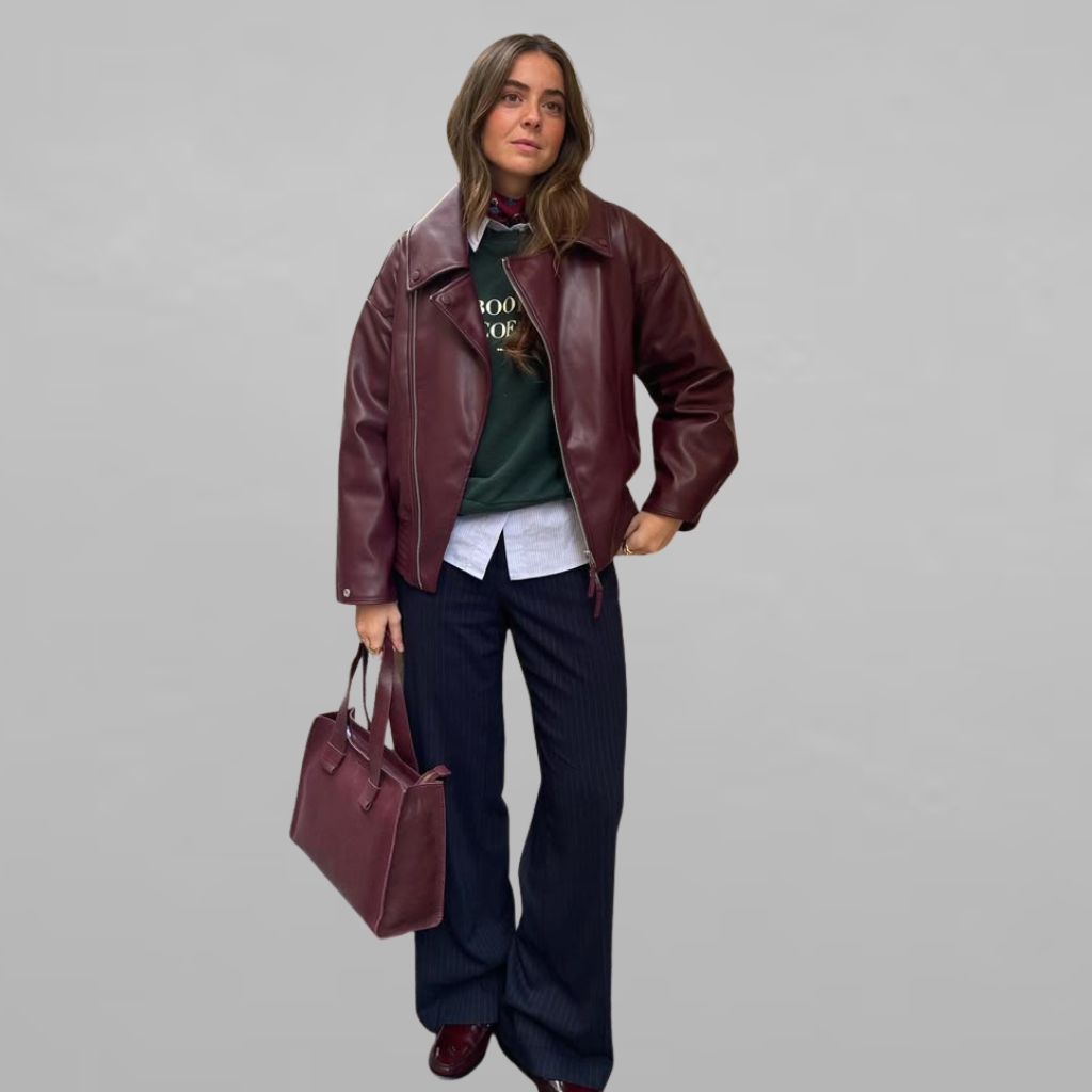 A modern hybrid leader jacket featuring a sleek, weather-resistant shell with a quilted inner lining, reinforced shoulders, and a subtle emblem on the chest.