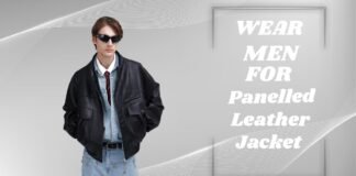 Panelled Leather Jacket for Stylish Comfort & Everyday Wear A man wearing a black leather jacket, light blue denim shirt, red tie, blue jeans, and sunglasses stands against a gray background with white curved lines and a framed panel displaying the text “WEAR MEN FOR Panelled Leather Jacket.”