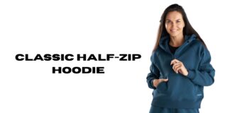 Classic Half-Zip Hoodie: The Perfect Blend of Style & Comfort A woman wearing a teal-blue classic fleece half-zip hoodie, standing against a white background with text that reads ‘CLASSIC HALF-ZIP HOODIE’.