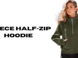 A woman wearing a dark olive green fleece half-zip hoodie with a front pocket, standing against a transparent background.