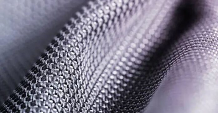 Close-up of tightly woven gray fabric with a soft, textured surface.Air Flex Knit Fabric: