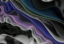 Pro Fit Compression Tech Fabric: Advanced Stretch & Strength Close-up view of multiple layered fabrics in wavy, overlapping folds. Colors include purple, blue, green, and silver, with a mix of mesh-like and smooth textures. Soft, diffused lighting highlights the depth and texture of the folds. ProFit Compression Tech Fabric