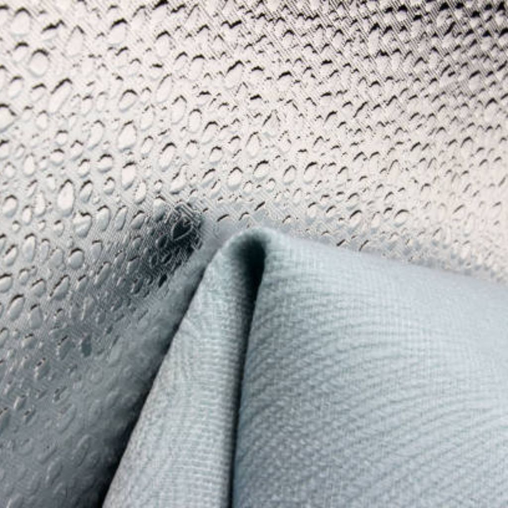 Frost Flex Cooling Fabric: Beat Heat with Smart Textiles 8 Light blue woven synthetic fabric with diagonal twill weave, subtle surface sheen, and gentle fold — typical of durable, weather-resistant military-inspired outerwear.
Frost Flex Cooling Fabric: