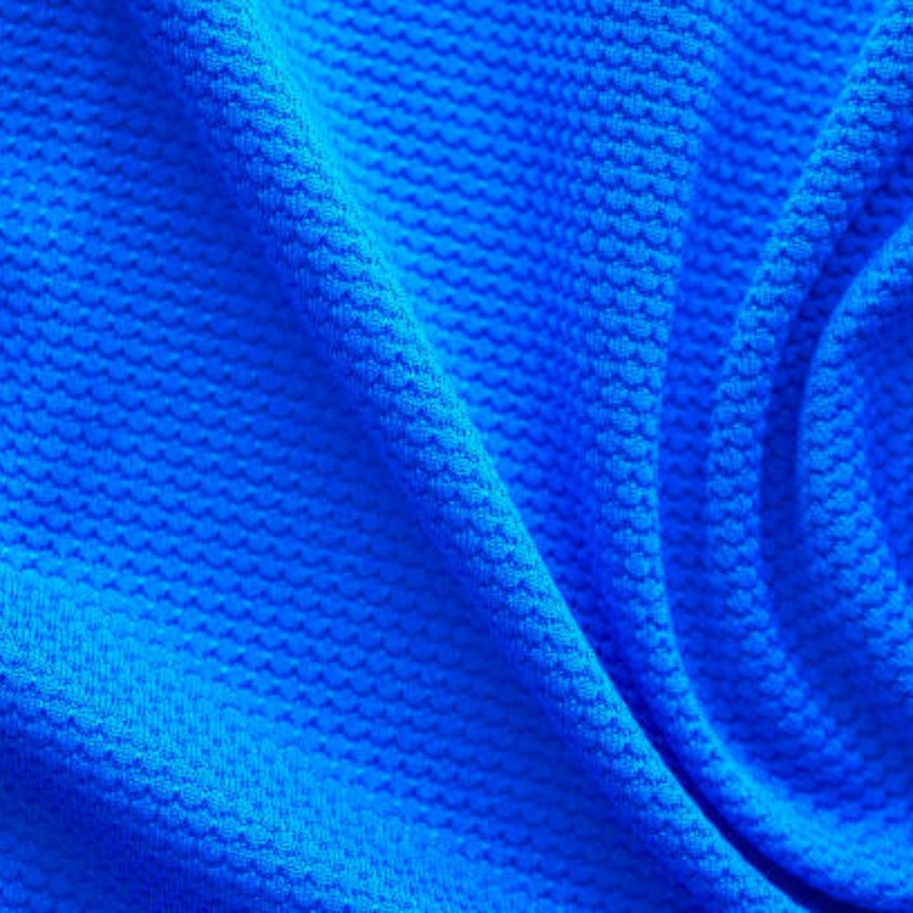 “Close-up of bright blue textured fabric with a honeycomb-like weave, likely from a military-inspired winter jacket.”

Rapid Dry Sports Fabric: