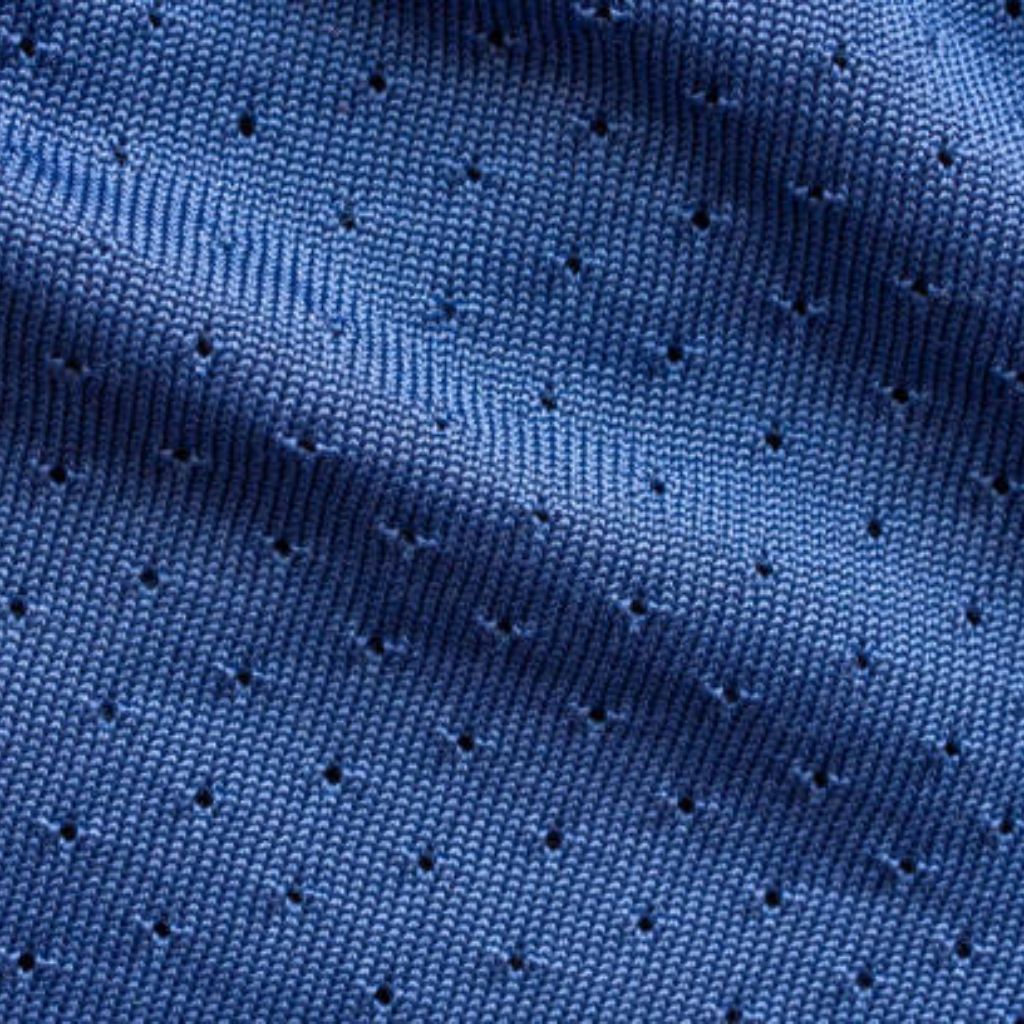 Close-up of blue, textured knit fabric with small perforations and subtle quilting lines, conveying a warm, durable textile.

Polar Lite Cooling Knit: