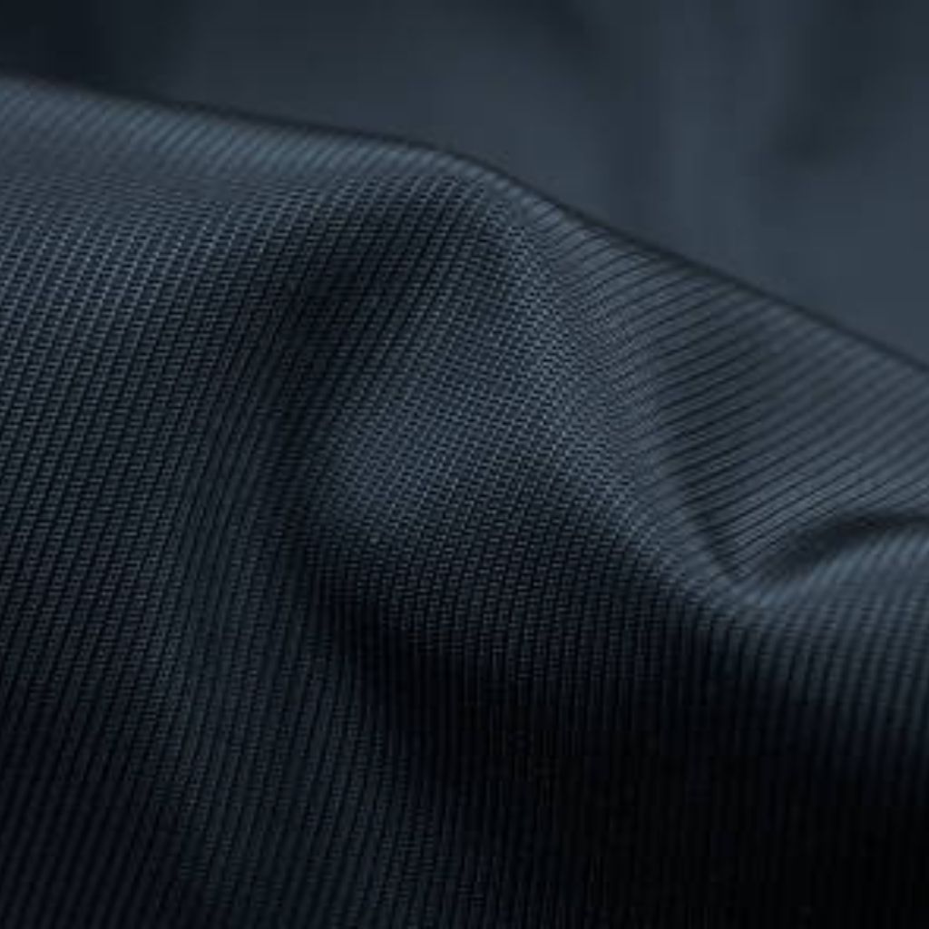 Glacier Dry Performance Fabric: Stay Cool, Dry & Game-Ready 13 Close-up of dark textured performance fabric with fine grid weave and soft drape.Glacier Dry Performance Fabric: