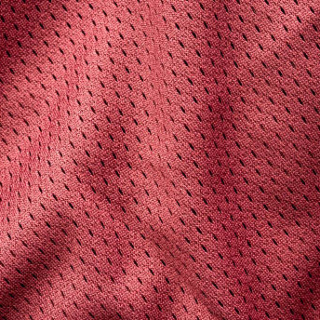 Close-up view of red Breeze Weave fabric with a subtle diagonal weave. The surface shows small, evenly spaced perforations and soft folds, conveying texture and depth.
Breeze Weave Athletic Fabric: