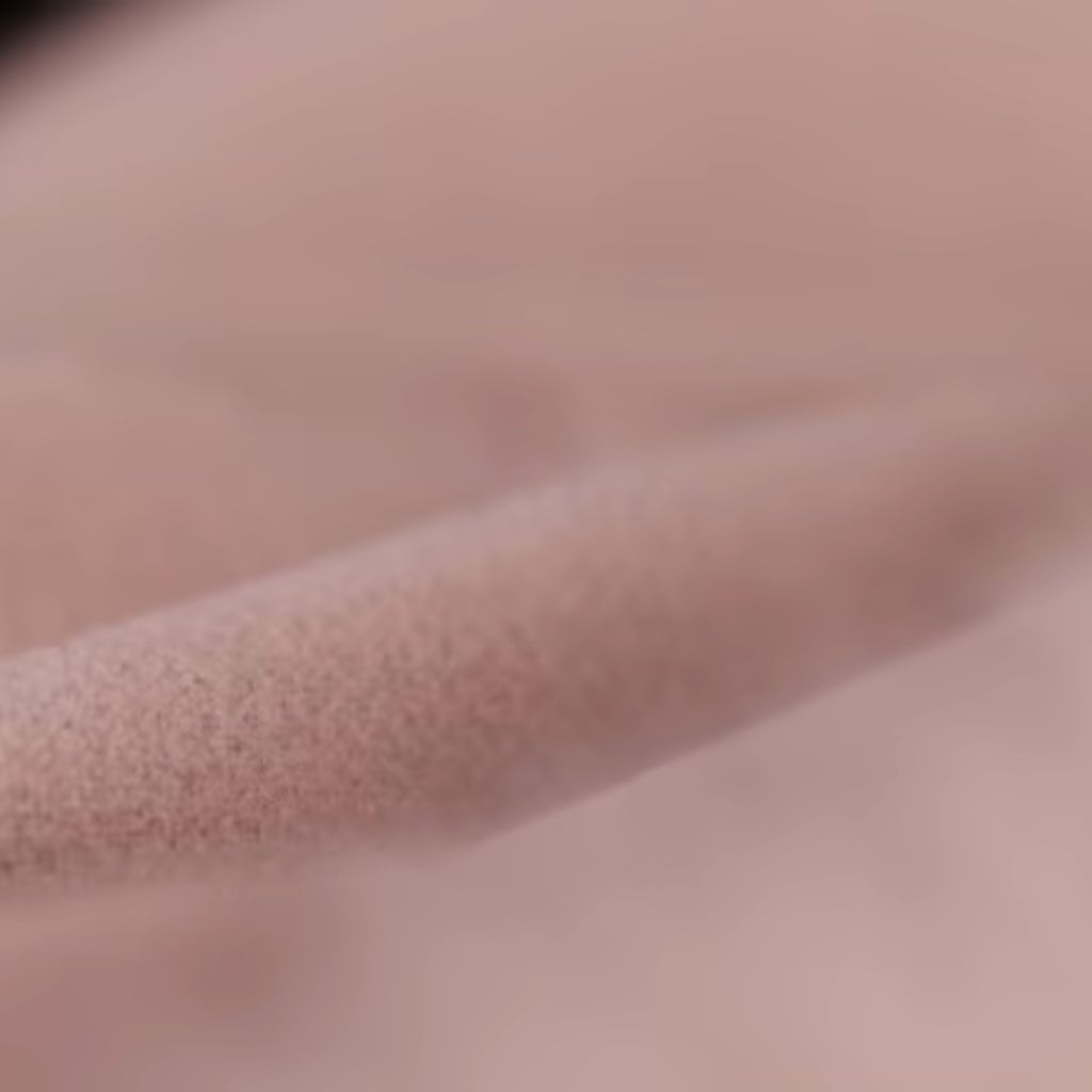 Arctic Pulse Activewear Fabric: Beat Heat, Boost Performance 1 Light pink high-performance fleece with dense plush pile and subtle matte sheen, shown in soft, precision-draped folds that reveal its thermal resilience and structured flexibility.
Arctic Pulse Activewear Fabric: