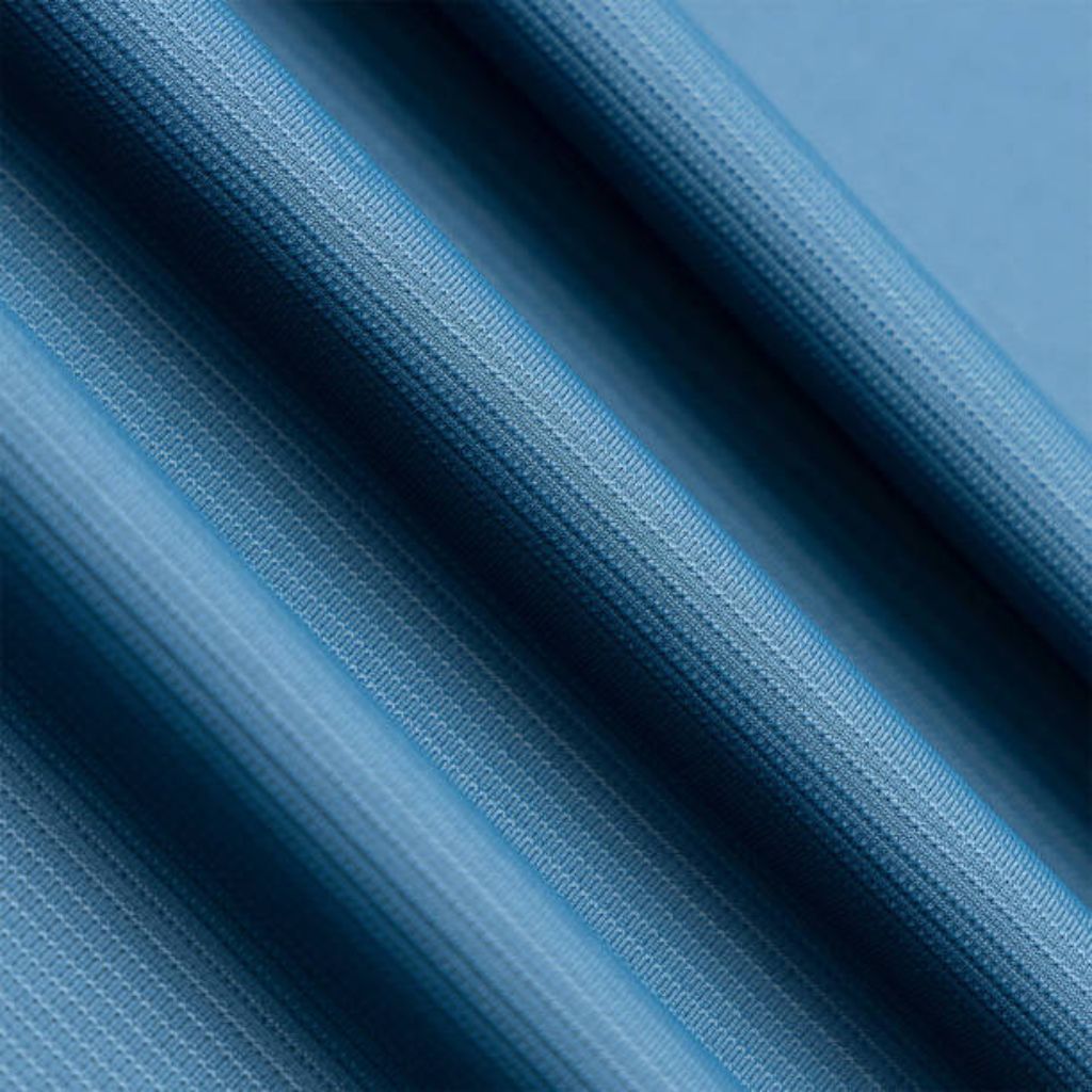 Glacier Cool Performance Fabric: Feel Cool, Stay Comfortable 7 "Close-up of blue ribbed fabric with diagonal texture; evenly spaced, rounded micro-ribs (~500 µm apart) channel airflow and enhance wind resistance."
Glacier Cool Performance Fabric: