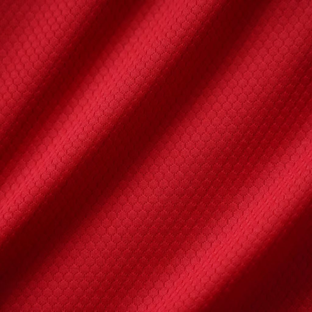 Swift Dry Athletic Performance Cloth: Maximum Breathability 9 "Close-up of red athletic fabric with subtle honeycomb texture and diagonal folds creating depth."
Swift Dry Athletic Performance Cloth: