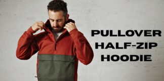 Pullover Half-Zip Hoodie: Comfort Meets Modern Style A man wearing a two-toned pullover hoodie (rust-colored top half and olive green bottom half) adjusts the hood while standing against an off-white, slightly textured wall. Large black text to the right reads “PULLOVER HALF-ZIP HOODIE.”