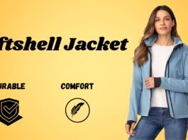 A woman wearing a light blue softshell jacket, white sweater, and jeans stands against a yellow gradient background. The text “Softshell Jacket” is displayed on the left, with icons and labels “Durable” and “Comfort” beneath.