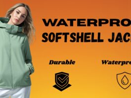 A model wearing a light green waterproof softshell jacket against an orange gradient background. The jacket has a high collar and front zipper with pockets at the sides.