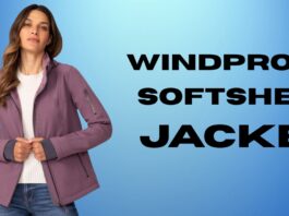 Windproof Softshell Jacket: Best Outdoor Protection Guide Woman wearing a mauve windproof softshell jacket, standing against a blue gradient background.