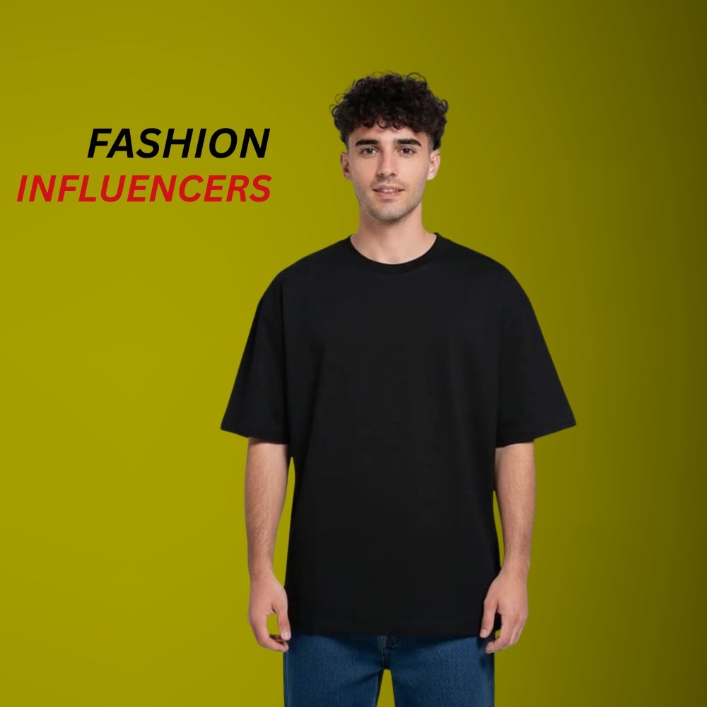 Trendy Men’s Longline T-Shirts – Effortless Style and Everyday Comfort 9 Black longline crew-neck t-shirt worn by a model, photographed on a green background with “FASHION INFLUENCERS” text on the top-left.