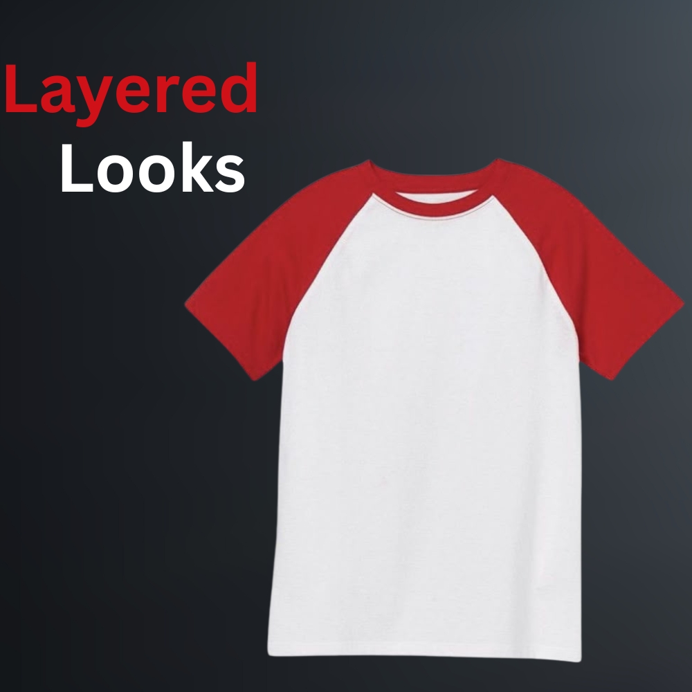 A front view of a classic ringer t-shirt with red sleeves and a white body, featuring a contrasting collar and hem trim on a dark background.